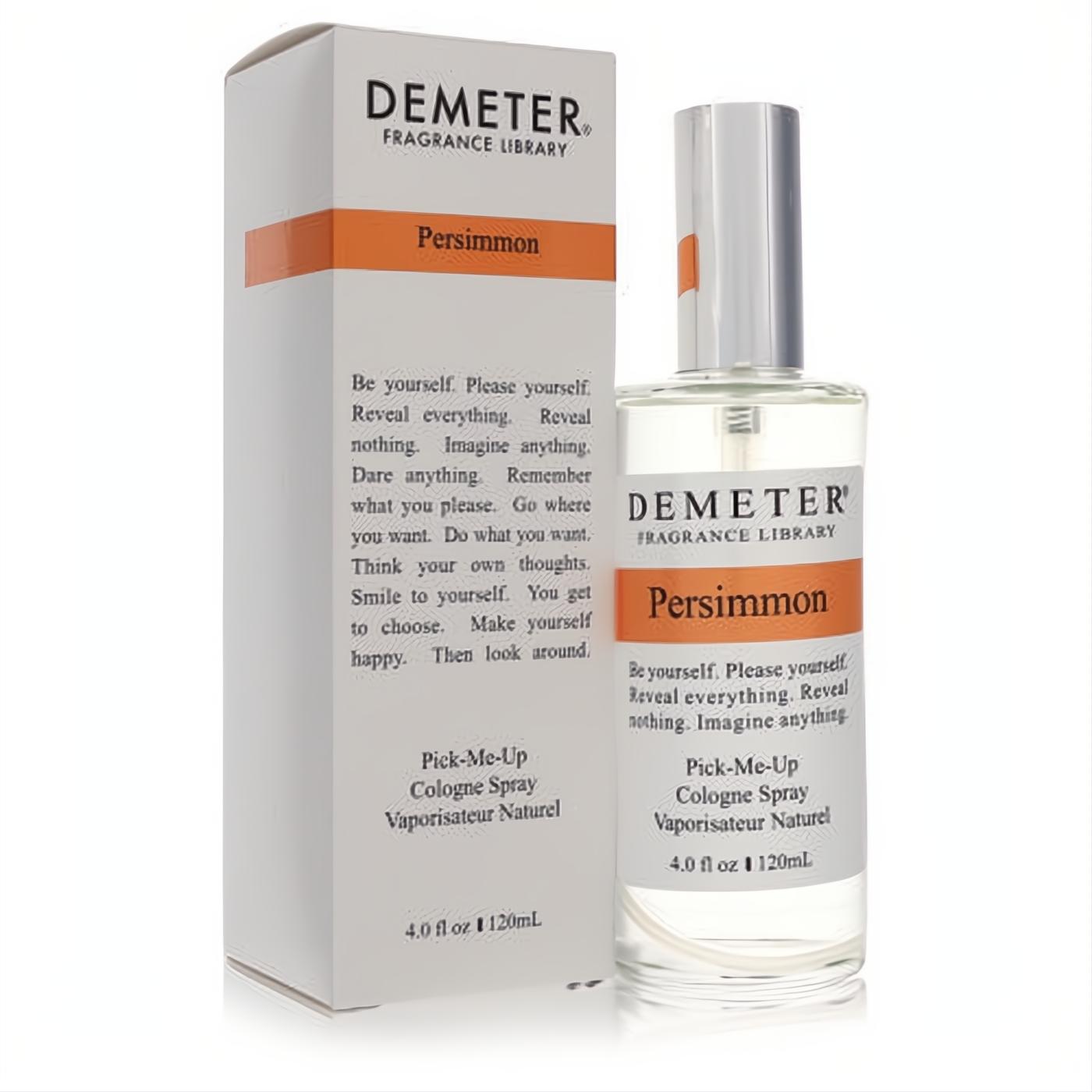 Demeter Persimmon 4 oz cologne spray in a sleek clear glass bottle with an orange label, next to its crisp white box.