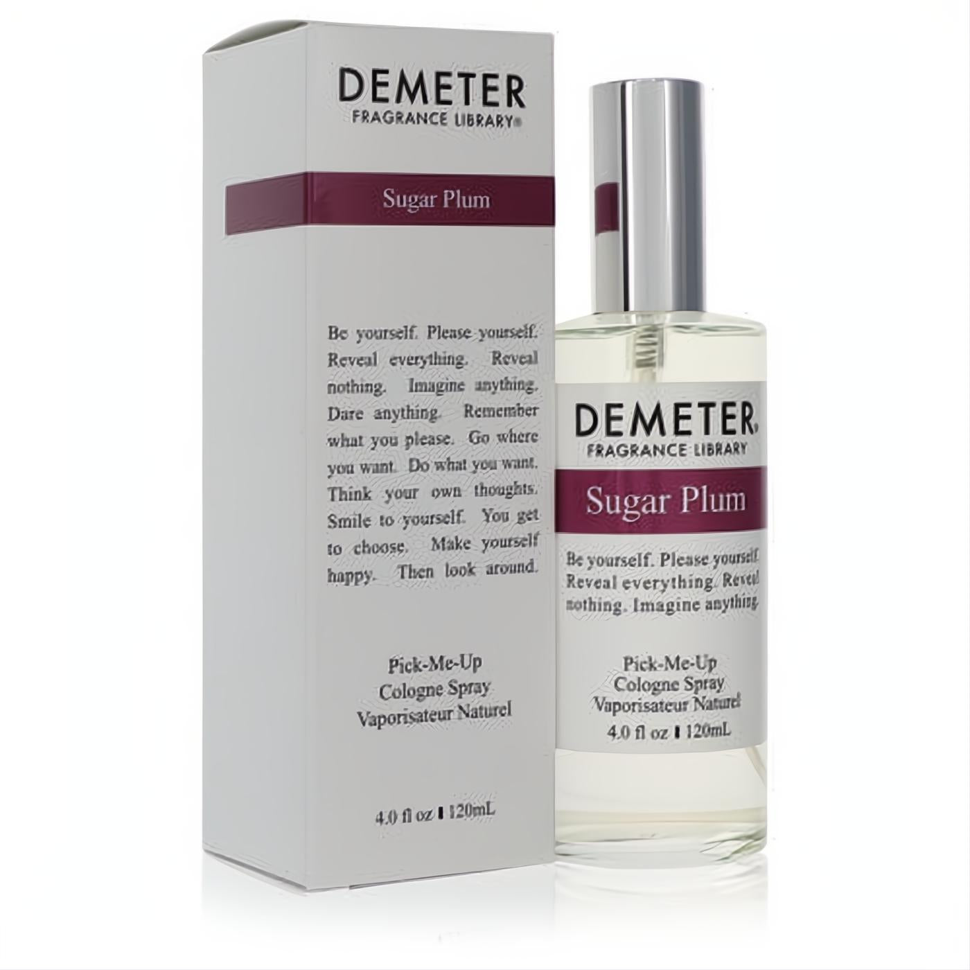 Unisex Demeter Sugar Plum 4 oz cologne spray. Clear glass bottle, sleek silver cap, and elegant white box with plum label.