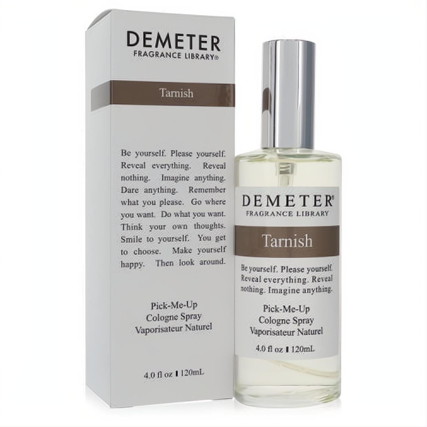 Demeter Tarnish 4 oz unisex cologne spray: clear glass bottle with silver cap, elegant white & brown label, displayed with its matching box.
