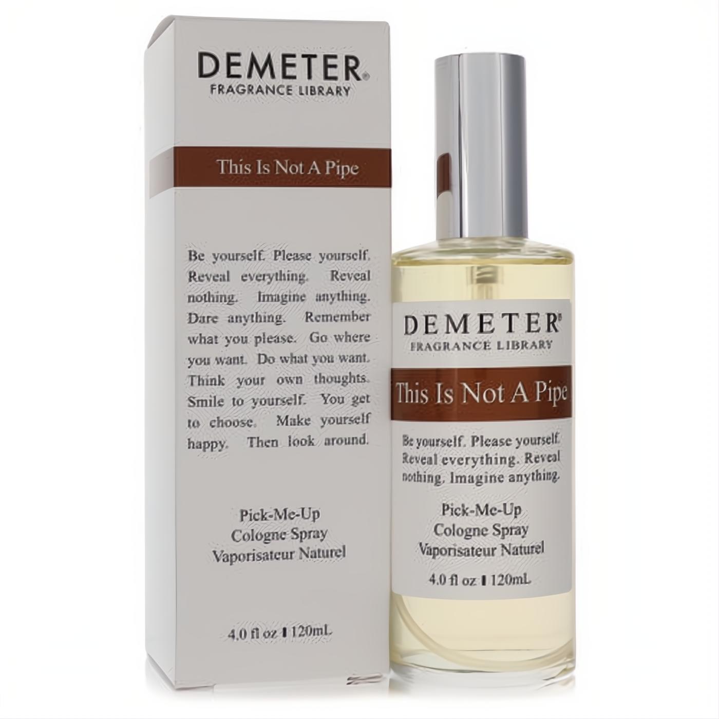 Demeter "This Is Not A Pipe" 4 oz cologne spray, clear bottle with silver cap, next to its white and brown box.