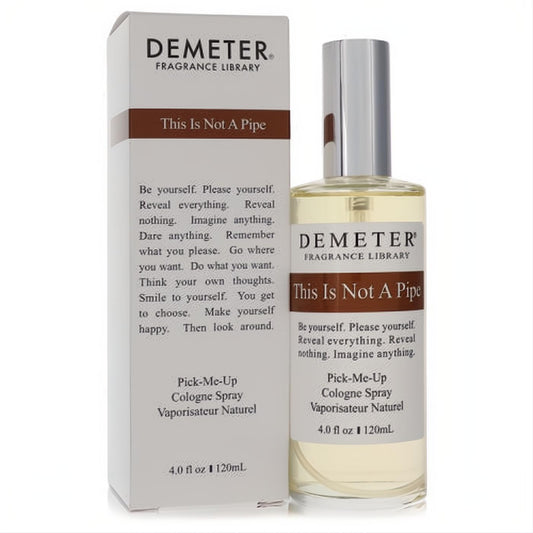 Demeter "This Is Not A Pipe" 4 oz cologne spray, clear bottle with silver cap, next to its white and brown box.