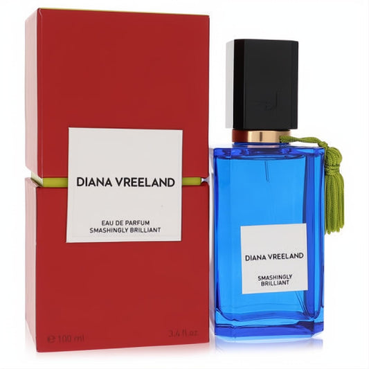 Stunning Diana Vreeland Smashingly Brilliant 3.4 oz unisex EDP in a vibrant blue glass bottle with a green tassel, beside its chic red box.