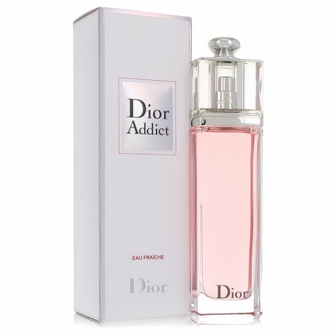 Dior Addict Eau Fraiche women's perfume. Clear glass bottle with sparkling light pink fragrance, alongside its elegant white box.