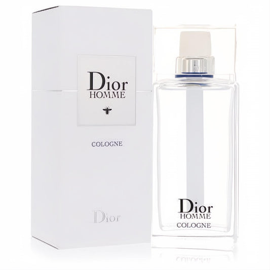 Elegant Dior Homme 4.2 oz men's cologne spray in a clear glass bottle with silver accents, next to its crisp white 2020 packaging.