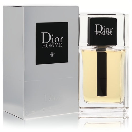 Experience Dior Homme: A luxurious men's cologne in a clear glass bottle with warm amber liquid, sleek black cap, and elegant silver box.