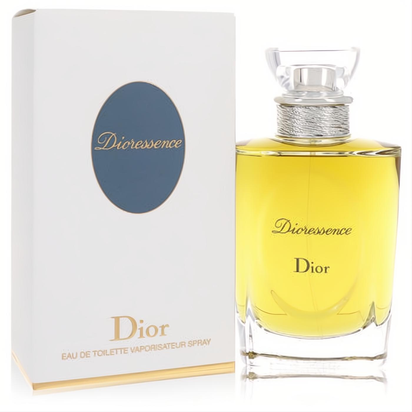 Exquisite Dioressence Dior EDT spray. Golden liquid in a clear glass bottle with silver accents, beside its chic white box with blue oval.