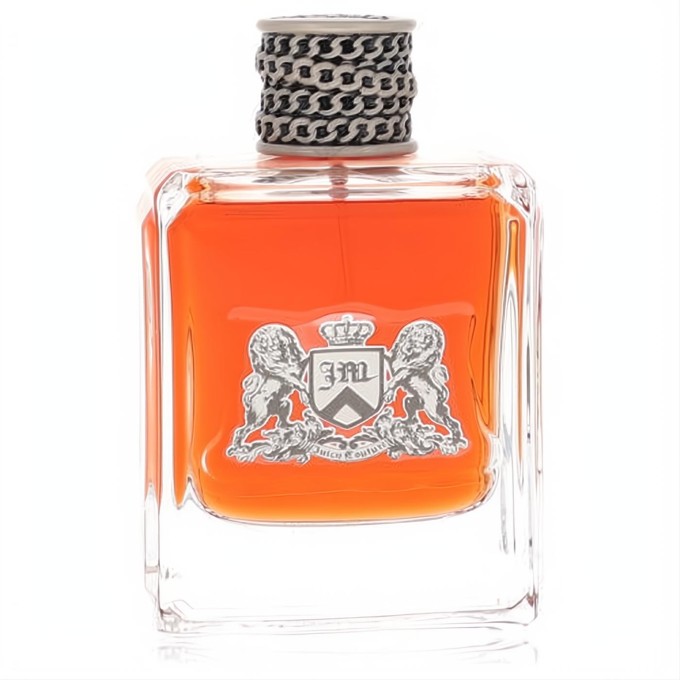 Striking Dirty English men's cologne by Juicy Couture in a clear glass bottle with vibrant orange liquid, silver crest, and unique chain-link cap.