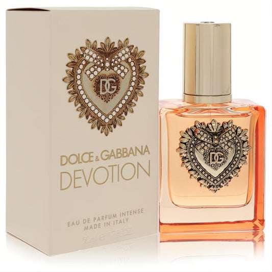 Luxurious Dolce & Gabbana Devotion Intense 1.7 oz EDP. Amber perfume in a clear bottle with an ornate gold DG heart emblem.