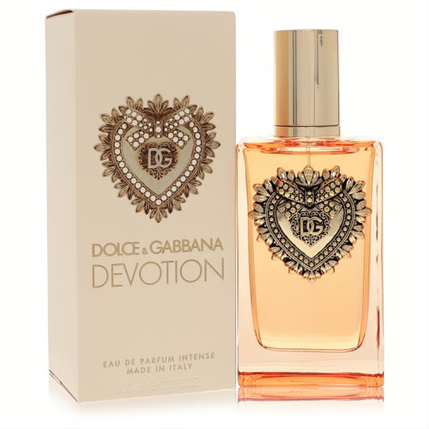 Dolce & Gabbana Devotion Intense EDP. Elegant clear bottle, warm amber liquid, and ornate gold heart with DG logo. Matching beige box.