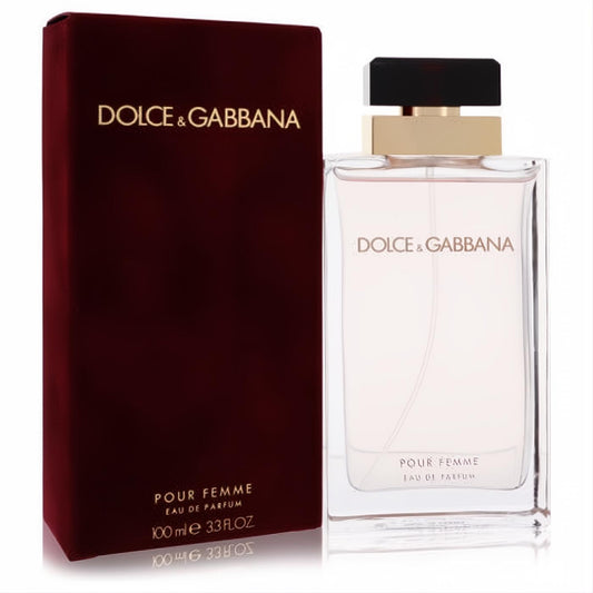 Luxurious Dolce & Gabbana Pour Femme 100ml EDP spray. Clear rectangular bottle with gold & black cap, next to its elegant red velvet box.