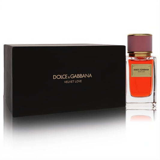 Luxurious Dolce & Gabbana Velvet Love 1.6 oz perfume spray, clear bottle with fiery orange liquid, gold accents, and elegant black box.