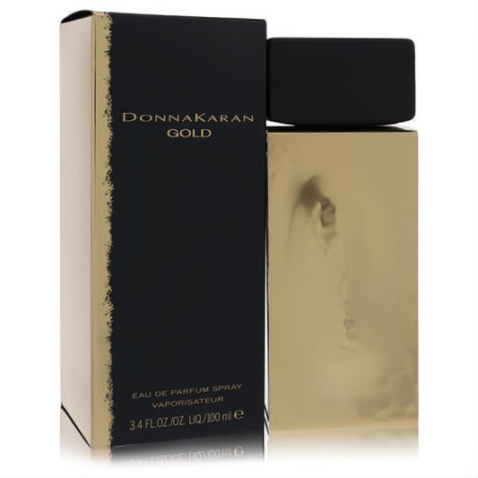Donna Karan Gold 3.4 oz women's Eau De Parfum. Sleek, reflective gold bottle with matte black cap and elegant black & gold box.