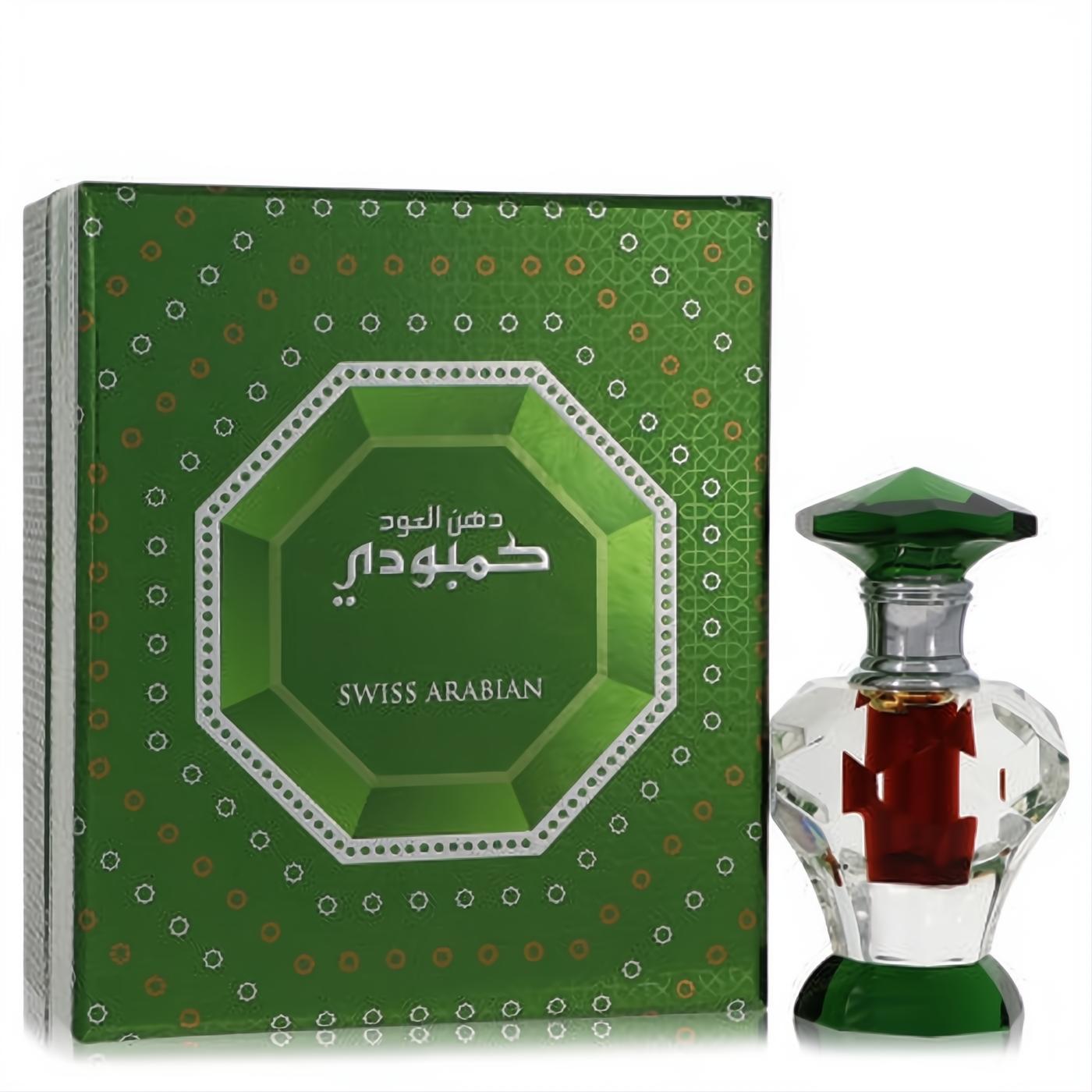 Swiss Arabian Dood Cambodi attar: small faceted clear glass bottle with rich red liquid, green gem-like cap, and elegant green box.