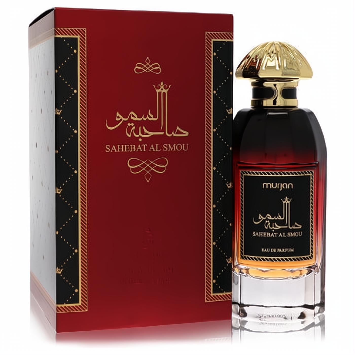 Exquisite Dumont Murjan Sahebat Al Smou unisex Eau De Parfum. Luxurious red-gold bottle with ornate cap, Arabic script, and elegant matching box.