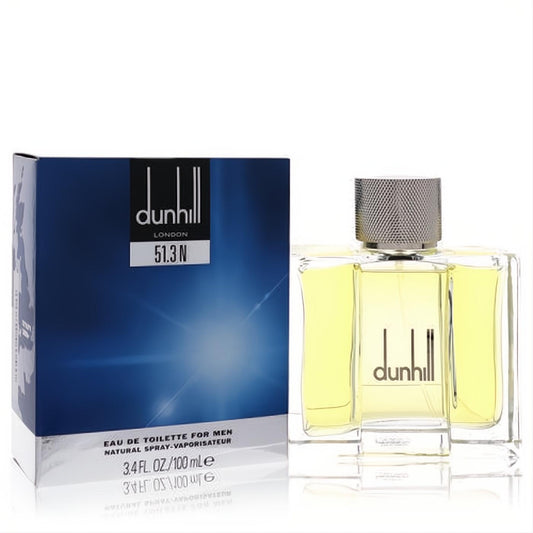Dunhill 51.3N men's Eau De Toilette 3.4 oz. Sophisticated clear glass bottle with yellow liquid, silver cap, beside its sleek blue and silver box.