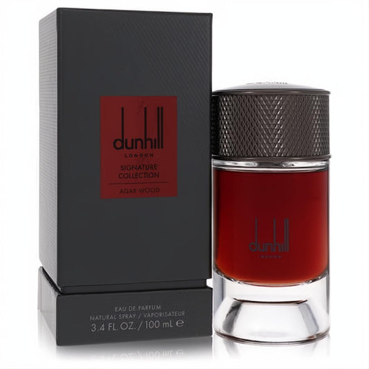 Dunhill Agar Wood 3.4 oz EDP. Rich dark red fragrance in a modern glass bottle with a textured cap, beside its sophisticated black box.