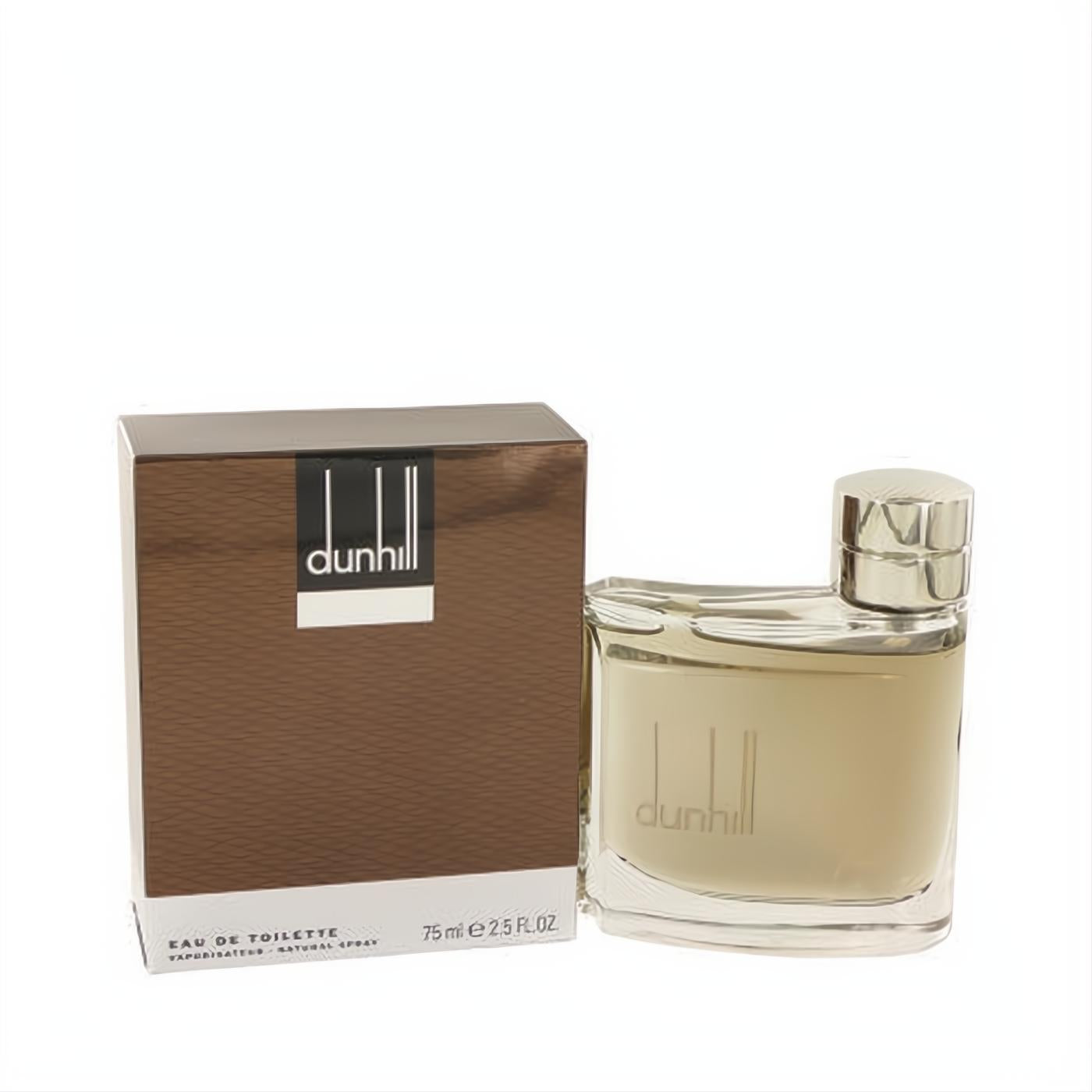 Dunhill Man 2.5 oz Eau De Toilette spray. Masculine amber fragrance in a sleek clear glass bottle with silver cap, next to its brown box.