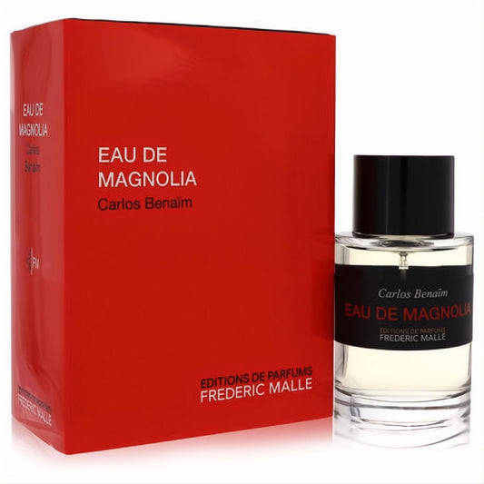 Luxury Frederic Malle Eau De Magnolia 3.4 oz EDT spray in a sleek clear glass bottle with black cap and vibrant red box.