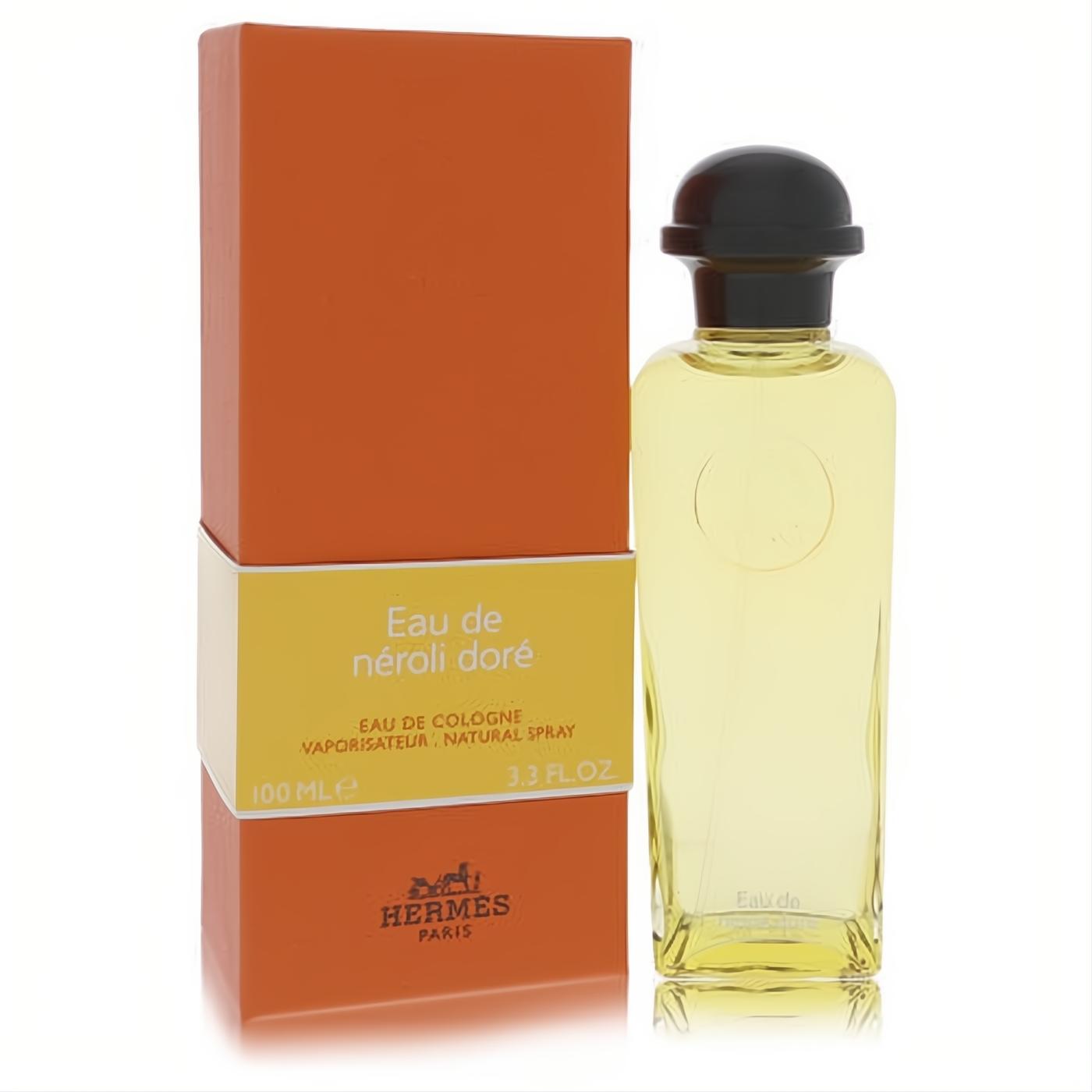 Elegant Hermes Eau De Neroli Dore 3.3 oz cologne, a clear glass bottle with vibrant golden liquid and a sleek black cap, beside its iconic orange box.