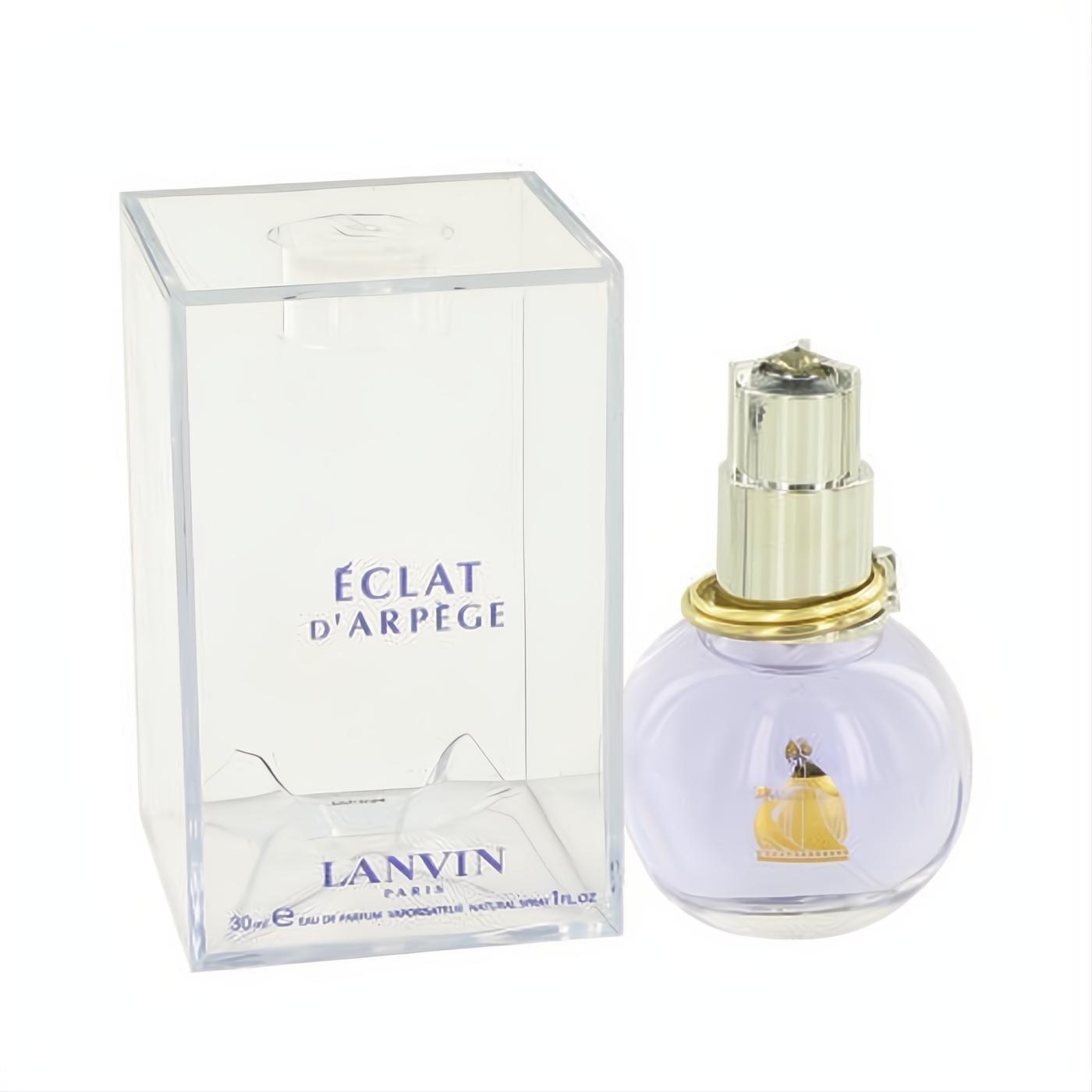 Experience Lanvin Eclat D'Arpege 1 oz perfume spray. Chic lavender bottle, gold accents, and clear branded box.