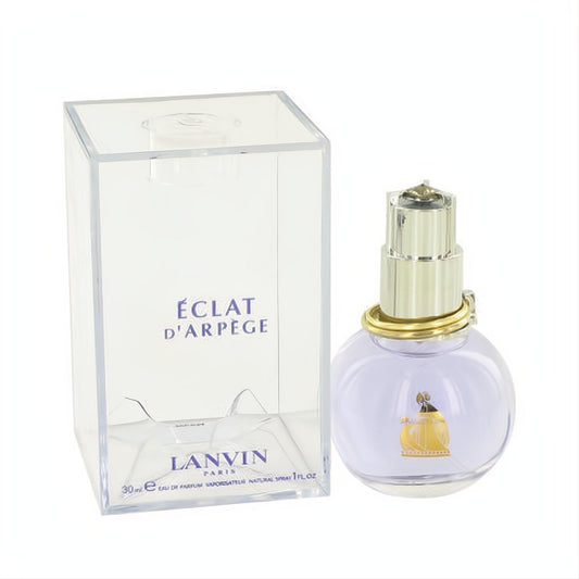 Experience Lanvin Eclat D'Arpege 1 oz perfume spray. Chic lavender bottle, gold accents, and clear branded box.