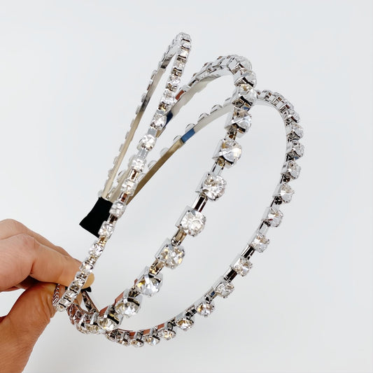 Dazzling silver triple-row headband adorned with brilliant clear crystals, perfect for elegant shine.