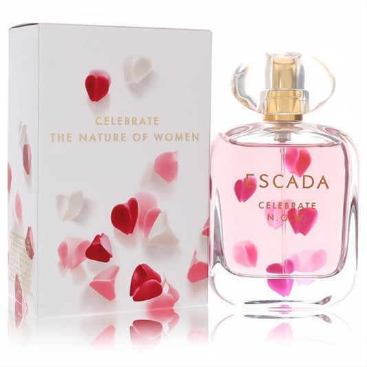 Captivating Escada Celebrate Now perfume: clear bottle with pink liquid, floating heart petals, gold cap, beside its elegant white box.