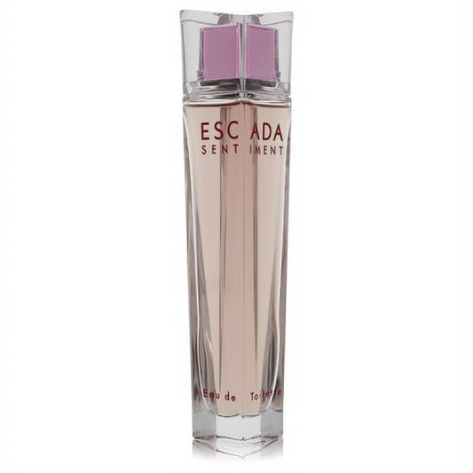 Elegant Escada Sentiment 2.5 oz women's Eau de Toilette spray. Clear glass bottle with radiant rosy fragrance and stylish pink-accented cap.