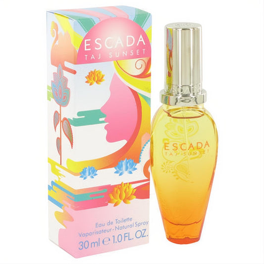 Escada Taj Sunset 1 oz EDT. Captivating yellow-orange perfume bottle with a silver cap, paired with its vibrant box featuring exotic sunset art.