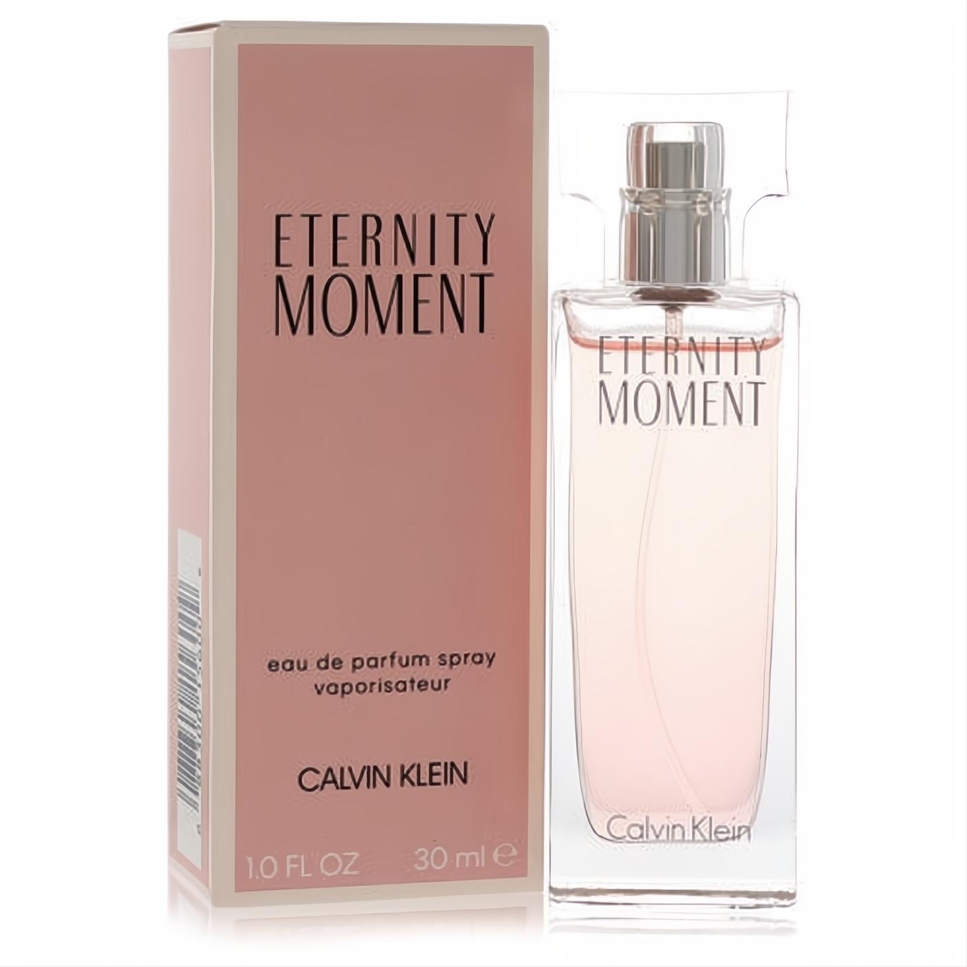Calvin Klein Eternity Moment 1 oz EDP spray. Elegant clear glass bottle with pale pink fragrance, silver cap, and soft pink box.