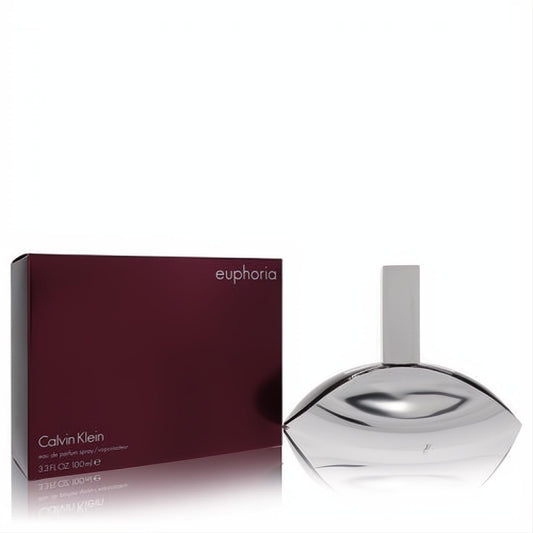 Euphoria by Calvin Klein 3.3 oz Eau De Parfum spray. Elegant silver metallic sculptural bottle next to its rich burgundy box.