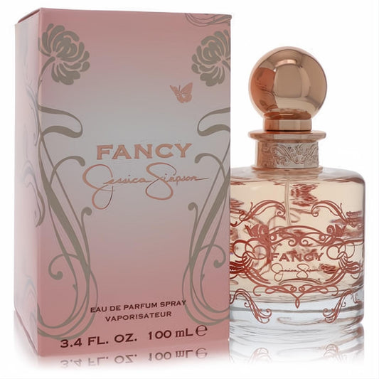 Experience Fancy by Jessica Simpson 3.4 oz EDP. Clear bottle with elegant rose gold cap, ornate floral design, and matching pink box.