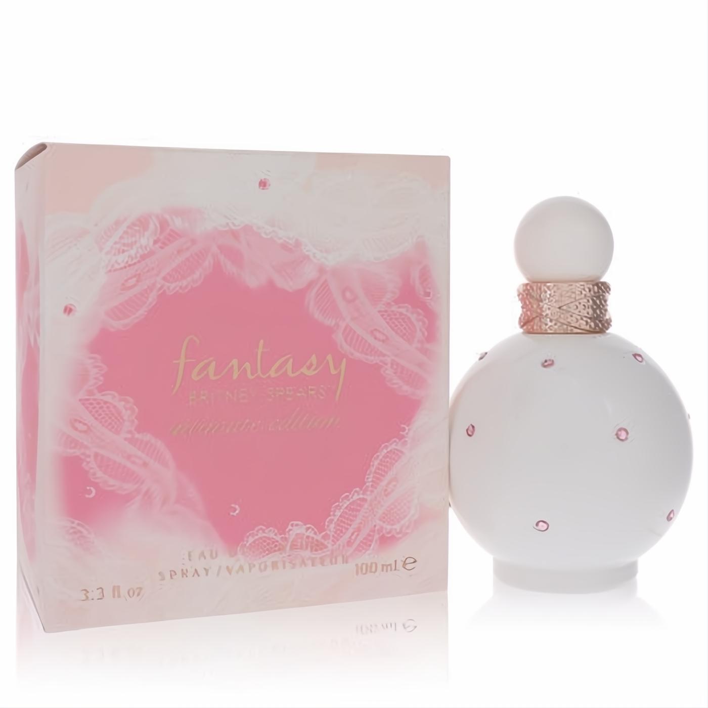 Elegant white Britney Spears Fantasy Intimate Edition perfume, 3.3 oz, with sparkling pink gems and rose gold accents, beside its delicate pink lace box.