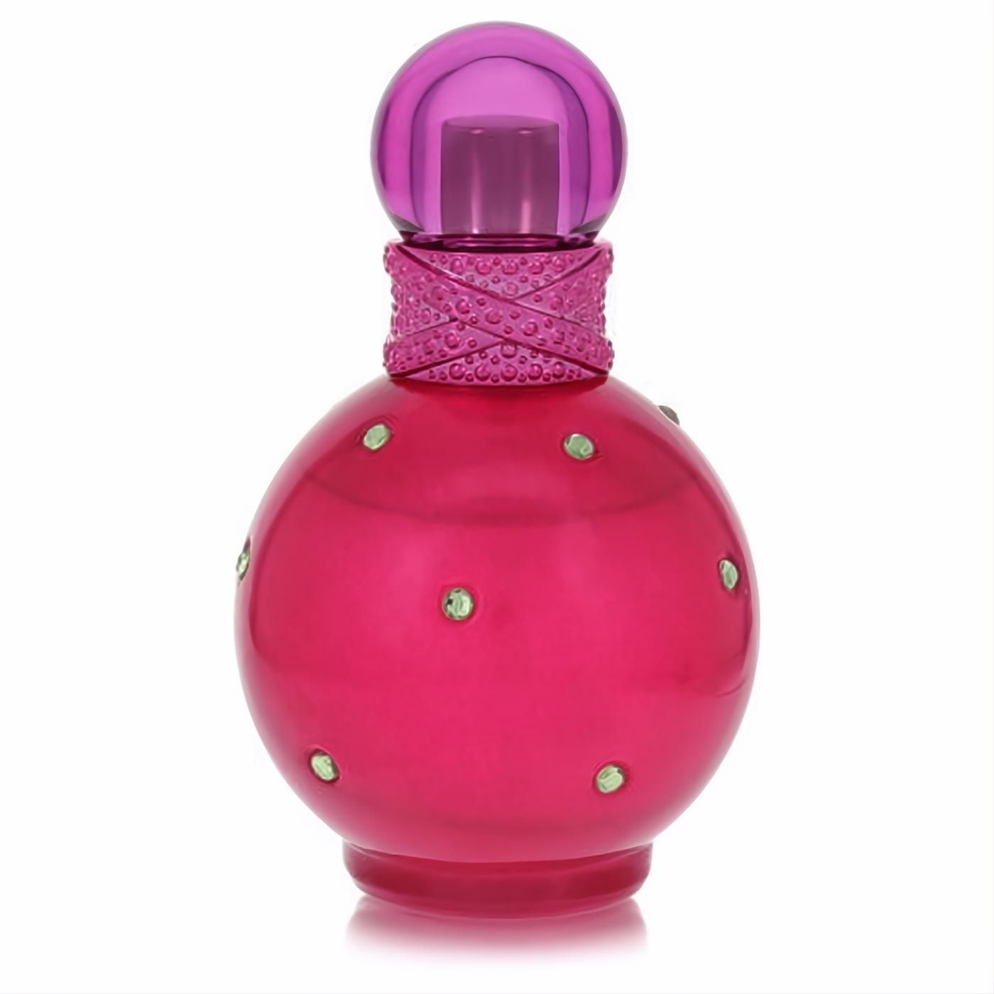 Experience Fantasy by Britney Spears! A dazzling fuchsia perfume bottle, adorned with sparkling green gems and a vibrant purple cap.