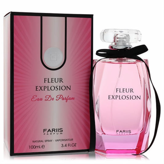Fariis Fleur Explosion 3.4 oz Eau De Parfum. Chic pink faceted bottle with black ribbon, beside its vibrant matching pink box.