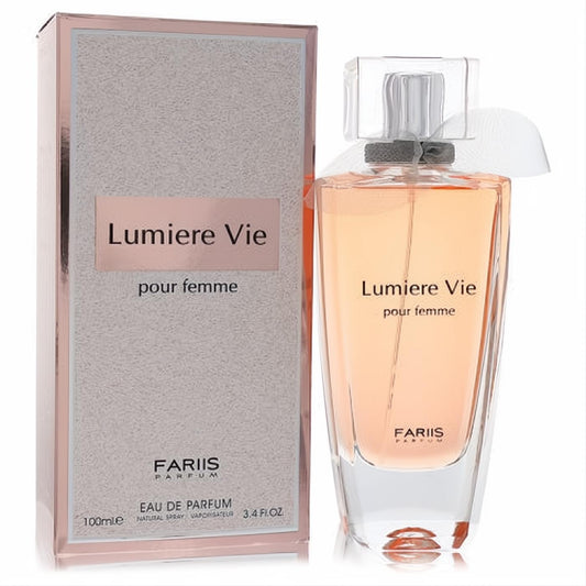 Elegant Fariis Lumiere Vie 3.4 oz Eau De Parfum. Clear glass bottle with radiant peach fragrance, delicate bow, and luxurious rose gold box.