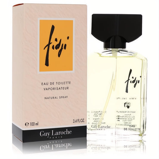 Fidji by Guy Laroche 3.4 oz Eau De Toilette. Luxurious clear glass bottle with a distinctive black cap and elegant beige box.