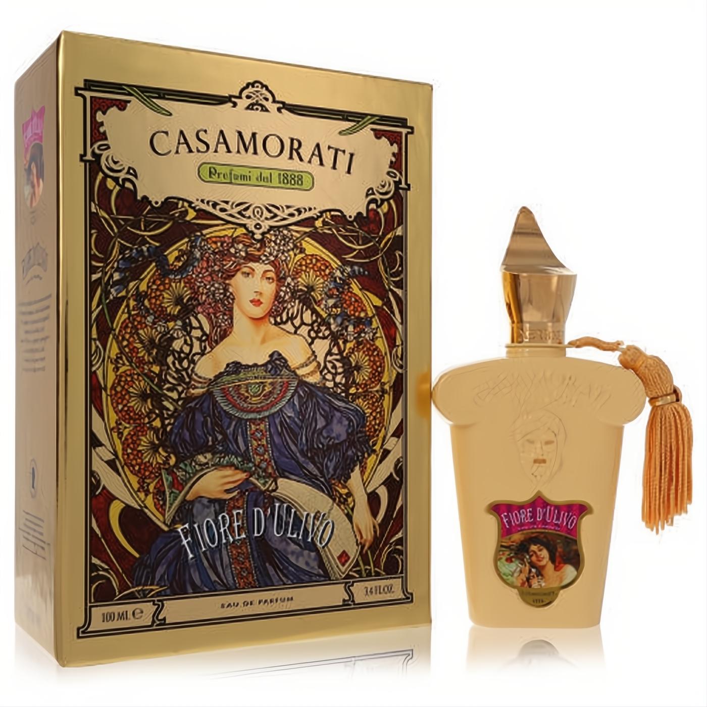 Opulent gold Casamorati Fiore D'Ulivo 3.4 oz women's perfume box with ornate art and unique cream bottle featuring a gold tassel.