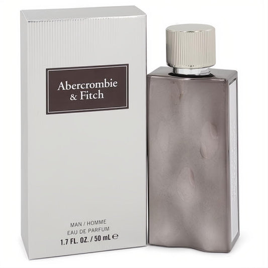 Abercrombie & Fitch First Instinct Extreme 1.7 oz men's EDP. Sleek smoky gray bottle, silver cap, and matching textured box.