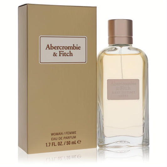 Abercrombie & Fitch First Instinct Sheer 1.7 oz EDP. Elegant clear glass bottle with rose gold cap and matching gold box.