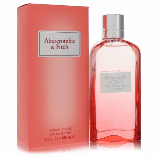 Elegant Abercrombie & Fitch First Instinct Together 3.4 oz women's Eau De Parfum. Features a chic pink glass bottle and matching coral box.