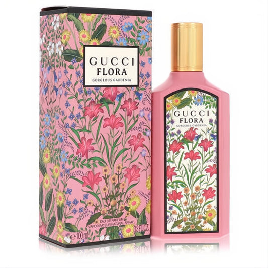 Gucci Flora Gorgeous Gardenia 3.4 oz EDP. Elegant pink bottle, gold cap, and vibrant floral box for a captivating women's fragrance.