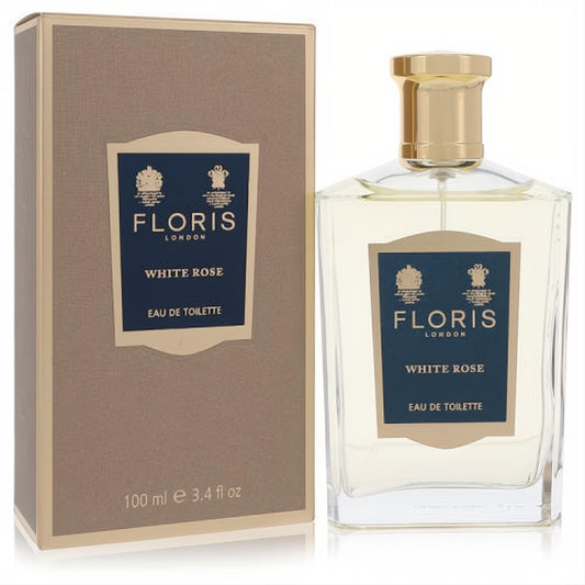 Floris White Rose 3.4 oz Eau De Toilette. Elegant clear glass bottle with gold cap, classic blue label, and sophisticated gold box.