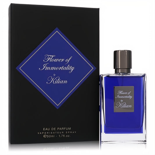Experience Kilian Flower of Immortality 1.7 oz EDP. Luxurious deep blue glass bottle with sleek dark cap, next to its elegant black box.