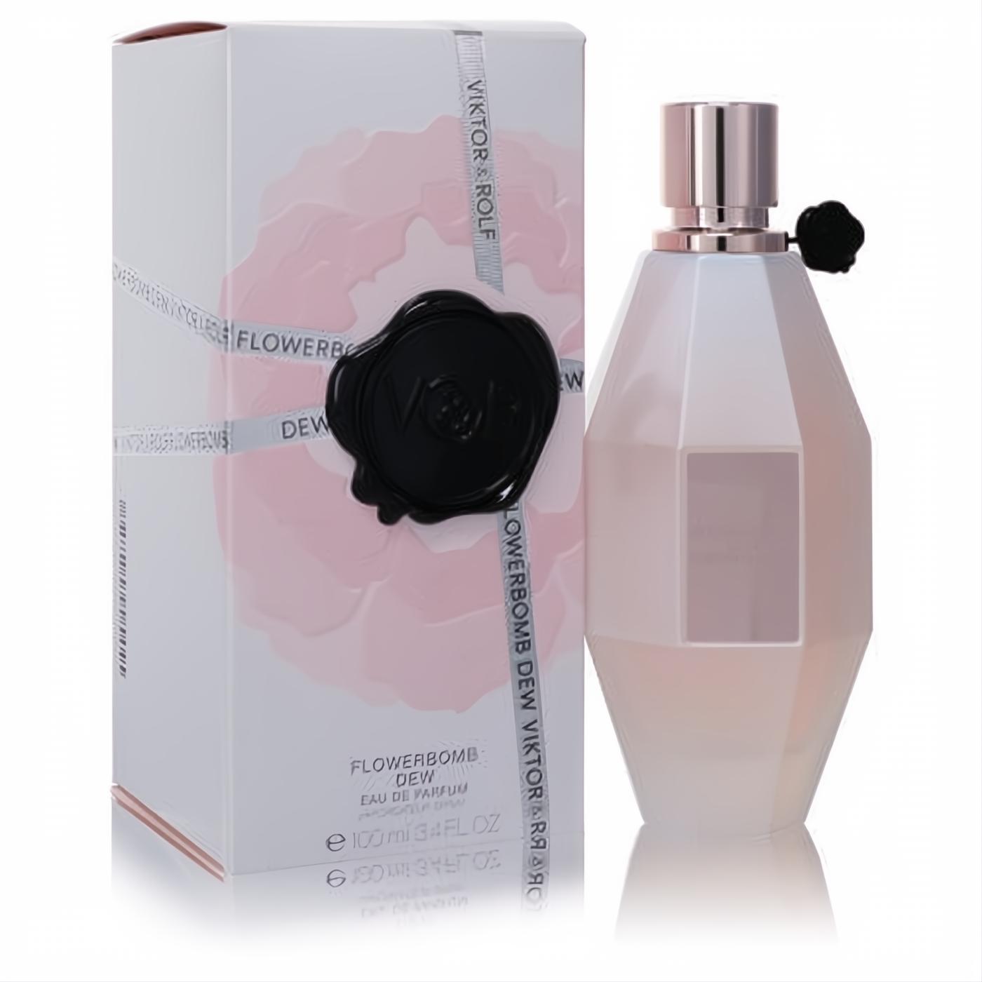 Elegant Viktor & Rolf Flowerbomb Dew 3.4 oz perfume bottle with frosted pink facets, rose gold cap, and black flower, beside its chic floral box.