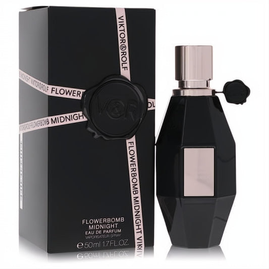 Flowerbomb Midnight 1.7 oz perfume. Sleek black faceted bottle with rose gold cap, label, and signature VR seal, next to its elegant box.