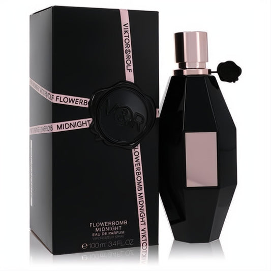 Elegant Viktor & Rolf Flowerbomb Midnight 3.4 oz EDP. Black faceted bottle with rose gold cap and label, paired with its sleek black and pink box.