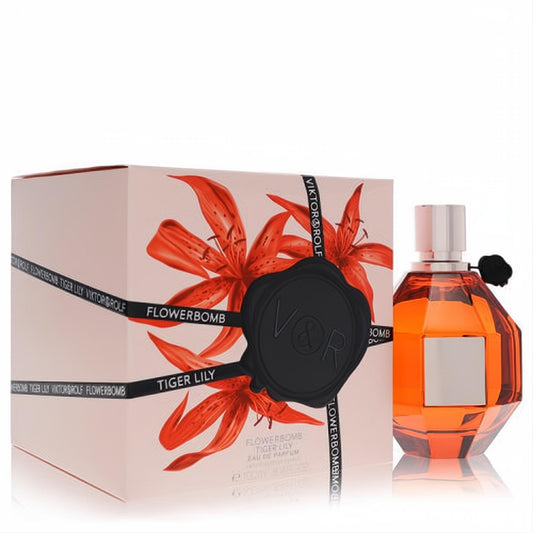 Viktor & Rolf Flowerbomb Tiger Lily 3.4 oz Eau de Parfum. Amber grenade bottle, elegant pink box with vibrant orange lilies and V&R seal.
