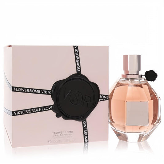 Luxurious Viktor & Rolf Flowerbomb 3.4 oz EDP spray. Elegant faceted glass bottle with pink fragrance and chic matching box.