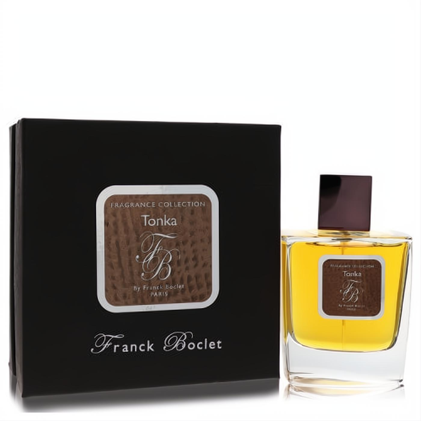 Franck Boclet Tonka 3.4 oz EDP: clear glass bottle with golden amber liquid, dark burgundy cap, next to its elegant black box.